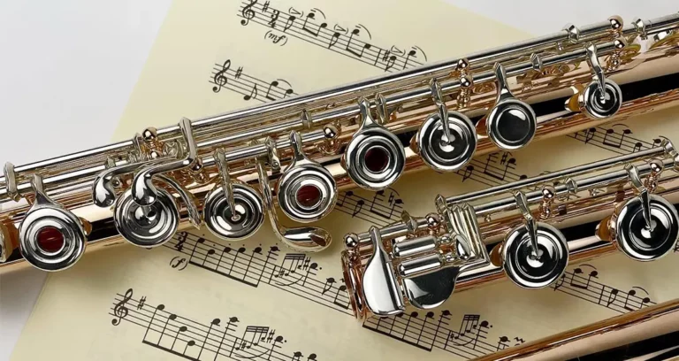 photo of a flute sitting on sheet music