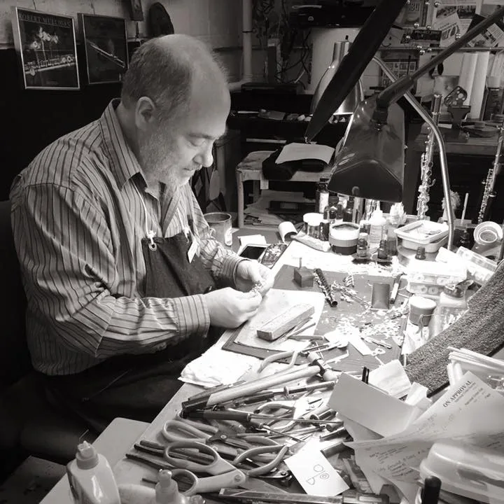 Photo of a technician working on a flute at Flute Specialists